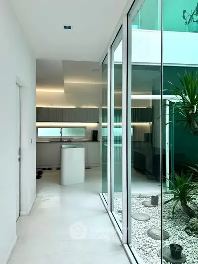 Modern kitchen with sleek design and indoor garden view