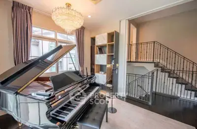 Luxurious living room with grand piano and elegant chandelier in a modern home