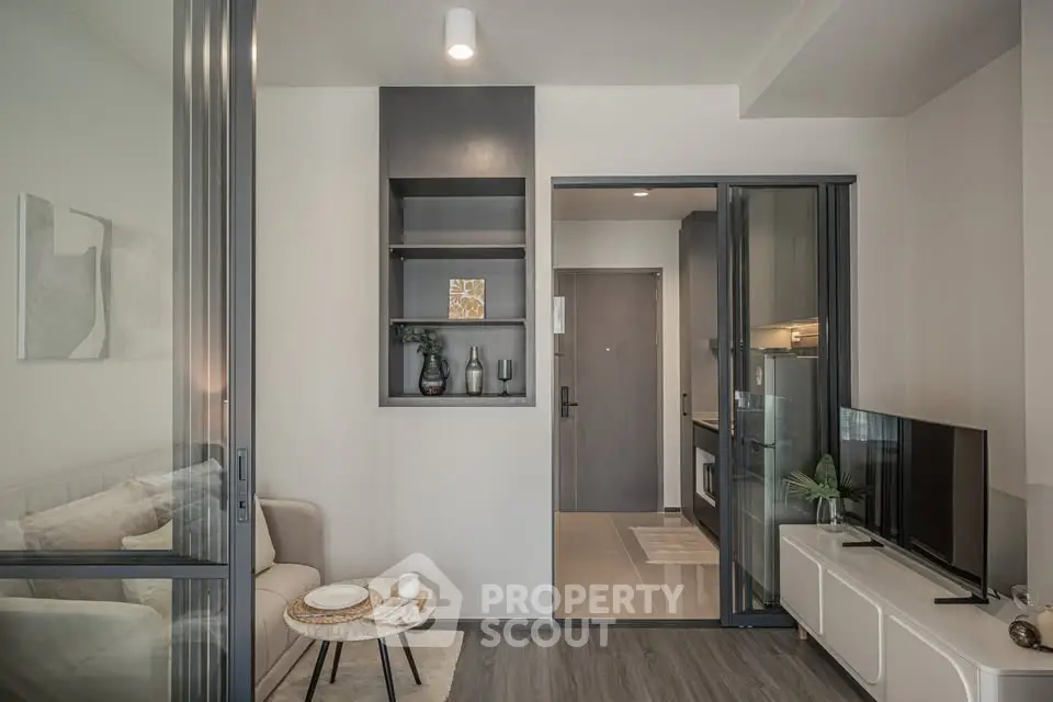 Modern living room with sleek design and open kitchen layout