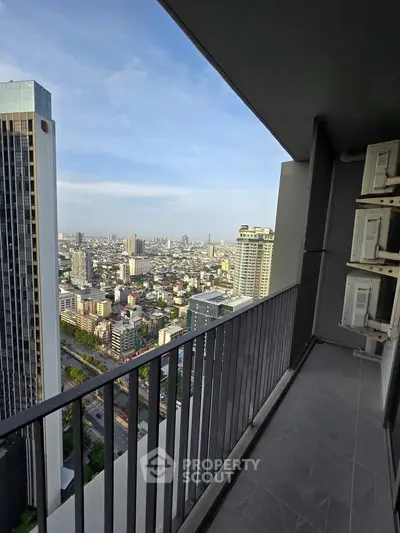 Stunning high-rise balcony with panoramic city views, perfect for urban living enthusiasts.