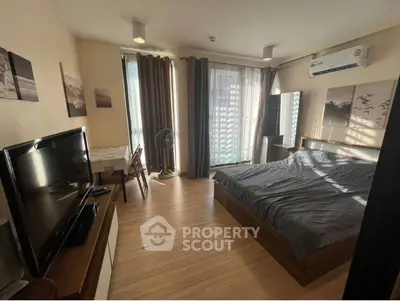 Spacious bedroom with large window and modern air conditioning unit.