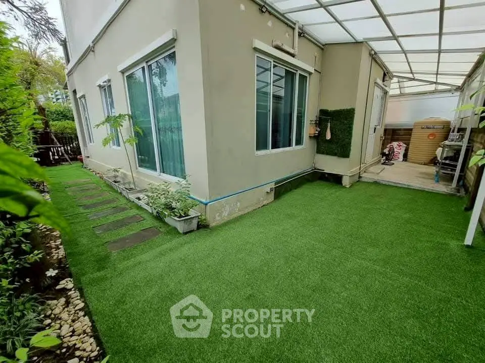 Charming corner unit with lush garden and modern exterior design, perfect for serene outdoor living.