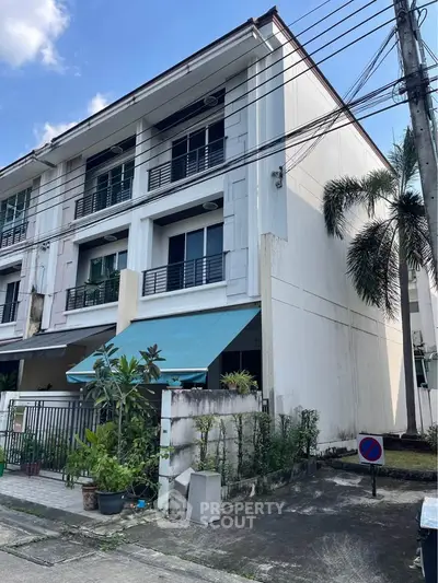 Spacious corner townhouse with modern design and lush greenery in a serene neighborhood.