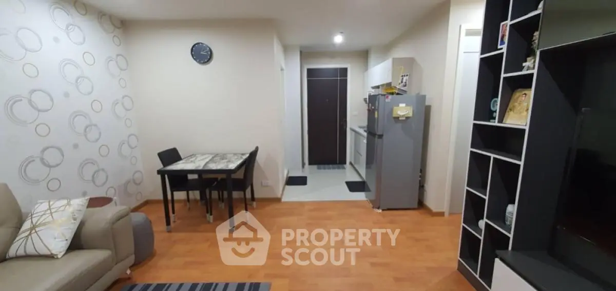 Modern living room with stylish decor and open kitchen layout