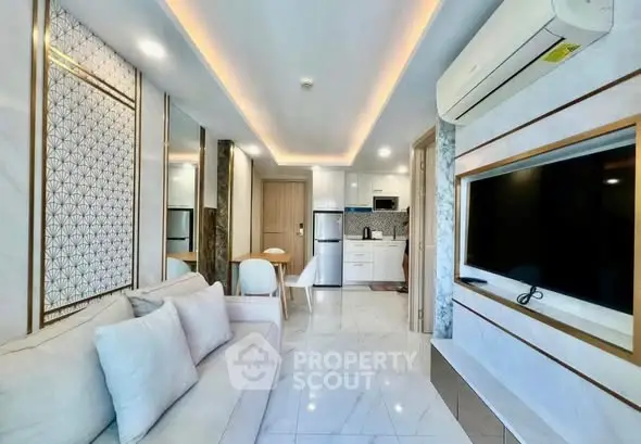 Modern living room with sleek design, open kitchen, and stylish decor in a contemporary apartment.