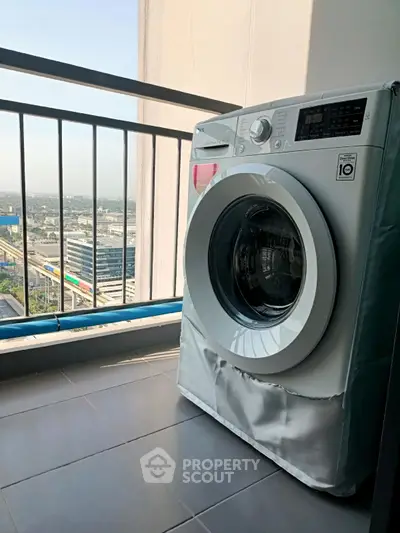 Modern balcony with washing machine and city view, perfect for urban living.