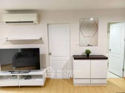 Modern living room with sleek TV setup and stylish decor