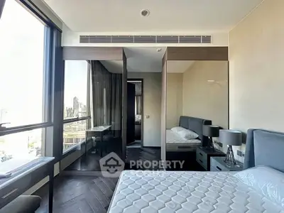 Modern bedroom with large windows and sleek design in urban apartment