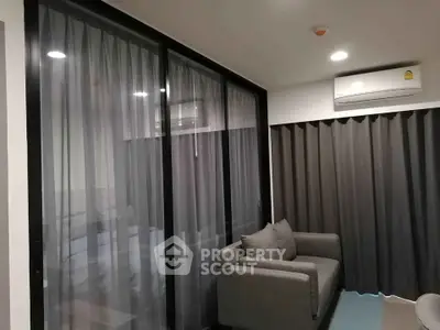 Modern living room with large windows and cozy sofa