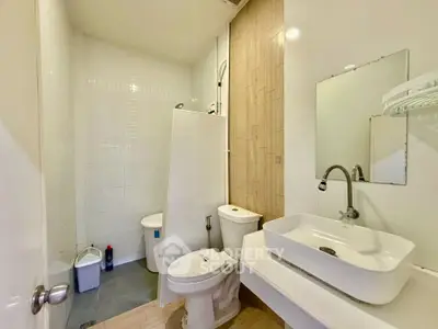 Modern bathroom with sleek fixtures and minimalist design in a contemporary home.