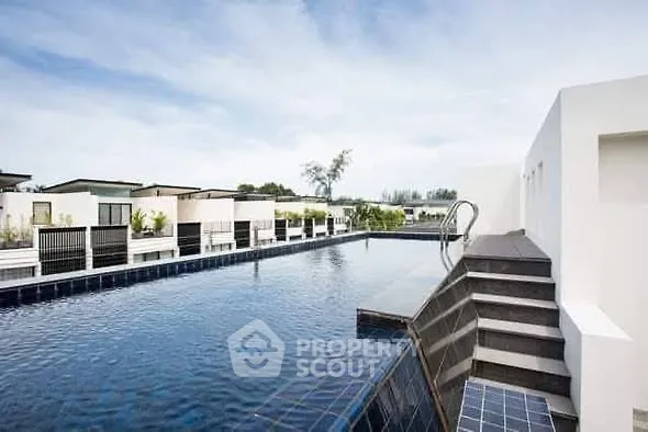 Luxurious rooftop pool with modern design and stunning views, perfect for relaxation and leisure.