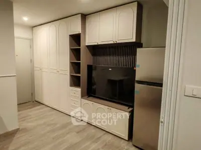 Modern living room with built-in storage and sleek TV setup