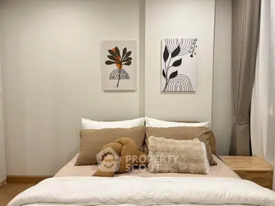 Cozy bedroom with modern decor and plush bedding, perfect for relaxation.