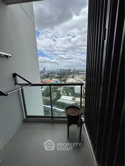Stunning high-rise balcony with panoramic city views, perfect for urban living.