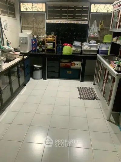 Spacious kitchen with ample storage and modern appliances, perfect for culinary enthusiasts.
