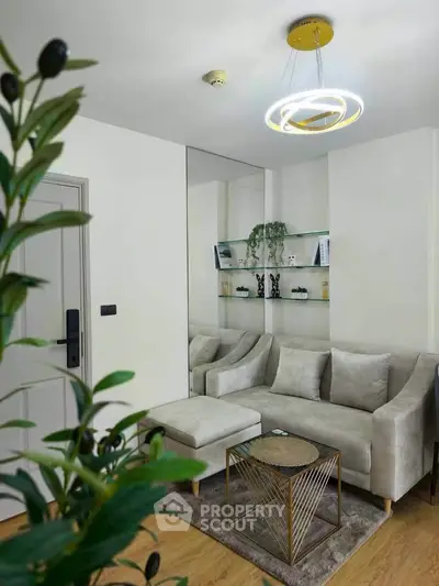 Modern living room with stylish furniture and elegant lighting, perfect for cozy gatherings.
