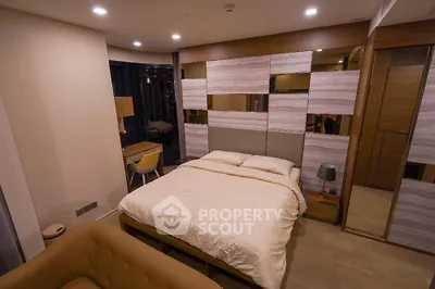 Modern bedroom with stylish decor and cozy ambiance, featuring a comfortable bed and elegant furnishings.