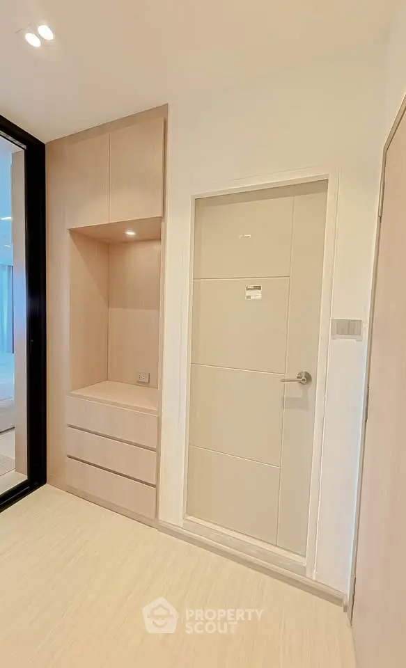 Modern minimalist interior with built-in storage and sleek door design
