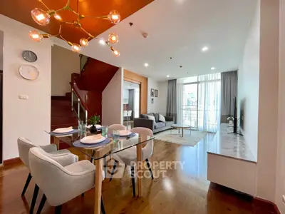Spacious modern living room with elegant dining area and large windows