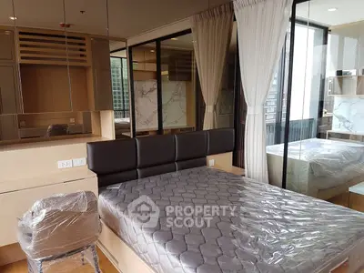 Modern bedroom with large windows and stylish decor in a high-rise apartment.