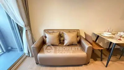 Cozy living room with elegant sofa and dining table, perfect for modern living.