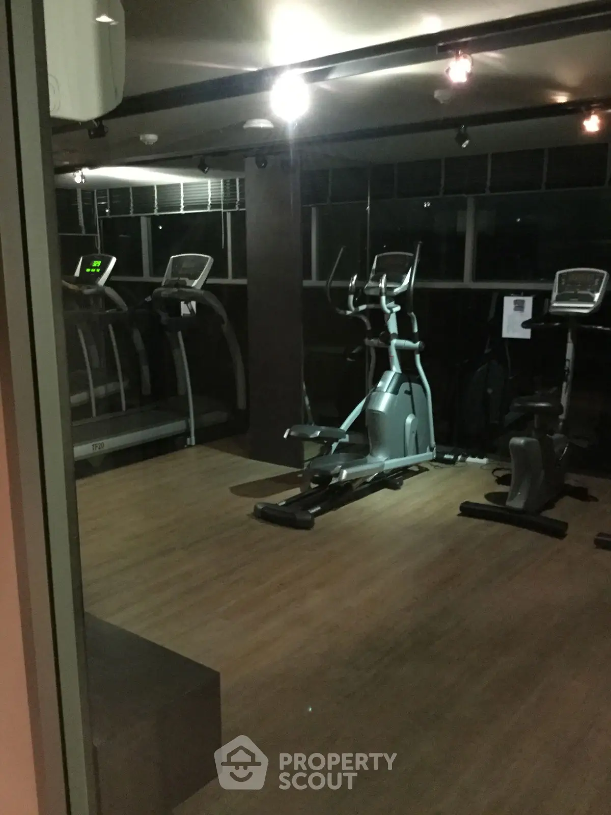 Modern gym with exercise equipment in a residential building