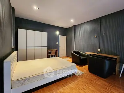 Spacious modern bedroom with sleek furniture and stylish decor