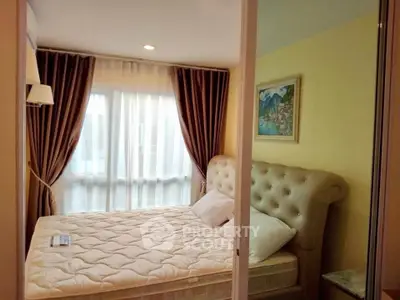 Cozy bedroom with elegant decor and large window for natural light