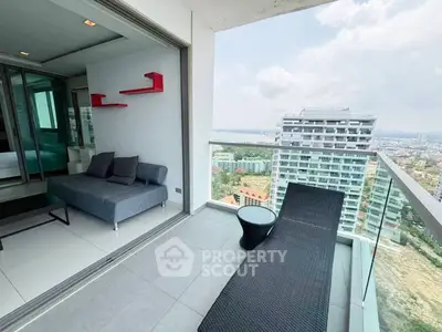 Modern high-rise apartment with spacious balcony and stunning city view