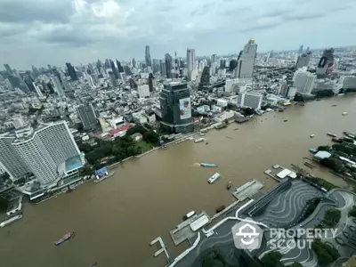 Stunning cityscape view with riverfront and skyscrapers, ideal for urban living enthusiasts.