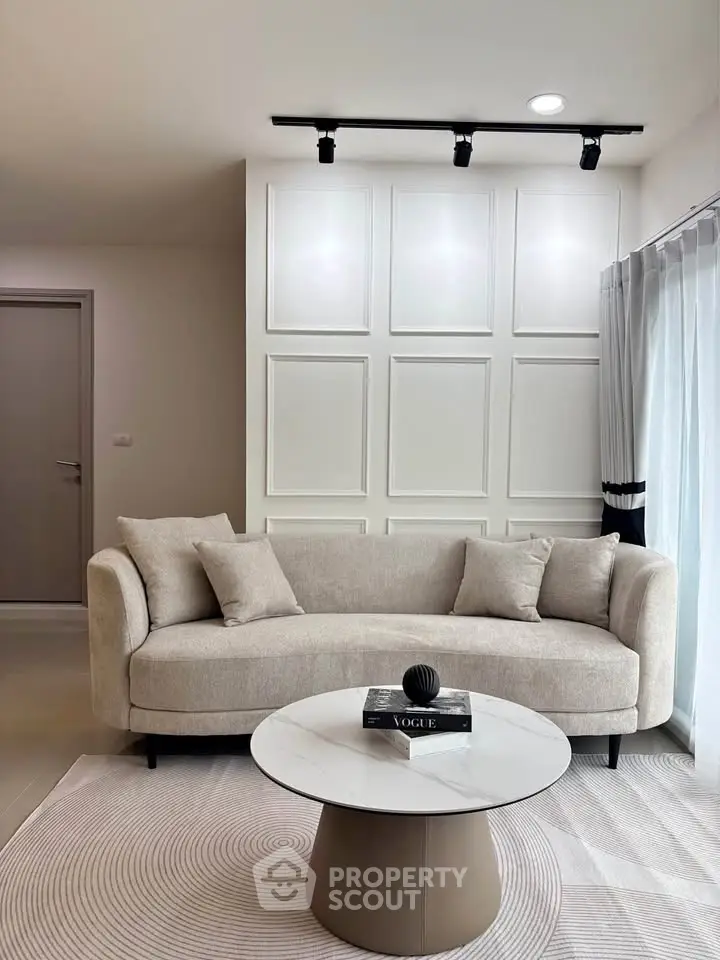 Elegant living room with modern beige sofa and stylish coffee table