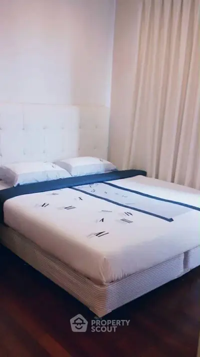 Cozy bedroom with elegant decor and plush bedding, perfect for relaxation and comfort.