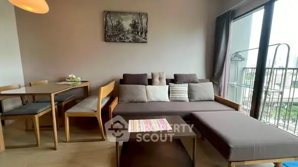 Modern living room with stylish furniture and large window balcony view