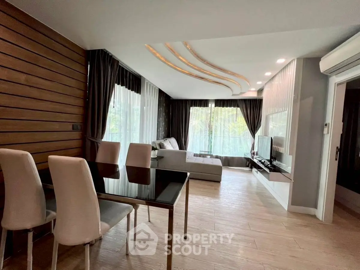 Luxurious modern living room with elegant decor and large windows