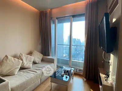 Modern living room with city view, featuring a cozy sofa and wall-mounted TV, perfect for urban living.