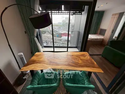 Stylish modern apartment with a cozy balcony and elegant wooden table, perfect for urban living.