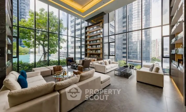 Luxurious modern living room with floor-to-ceiling windows and stunning city views.
