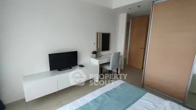 Modern bedroom with TV and desk in minimalist design