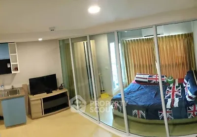 Modern studio apartment with glass partition and stylish decor