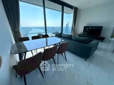 Luxurious living room with stunning city view, modern furniture, and floor-to-ceiling windows.