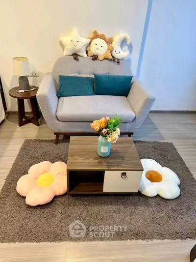 Charming living room with cozy sofa, playful cushions, and stylish decor