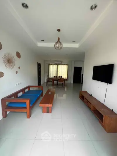 Spacious modern living room with minimalist decor and natural light