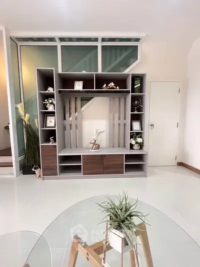 Modern living room with stylish shelving and decor accents