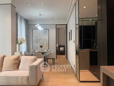 Modern open-plan living and dining area with elegant decor and natural light