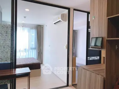 Modern studio apartment with glass partition and natural light