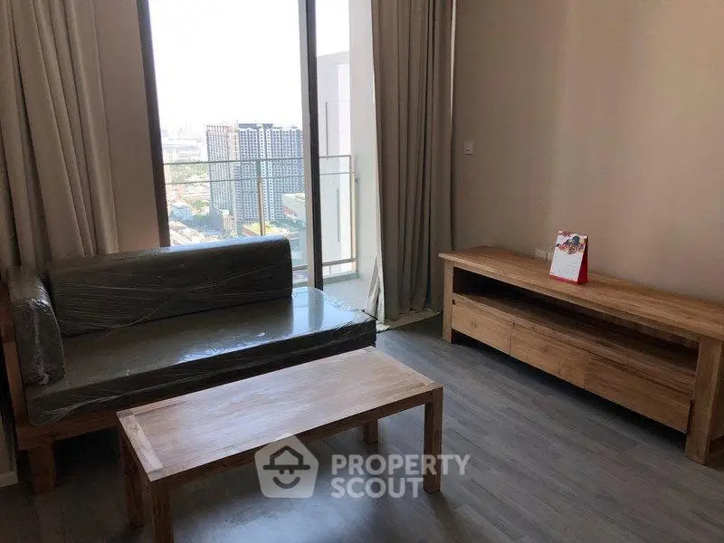 Modern living room with wooden furniture and city view balcony.