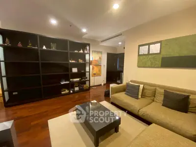 Spacious living room with modern decor and wooden flooring