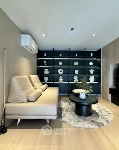 Modern living room with stylish decor and built-in shelving