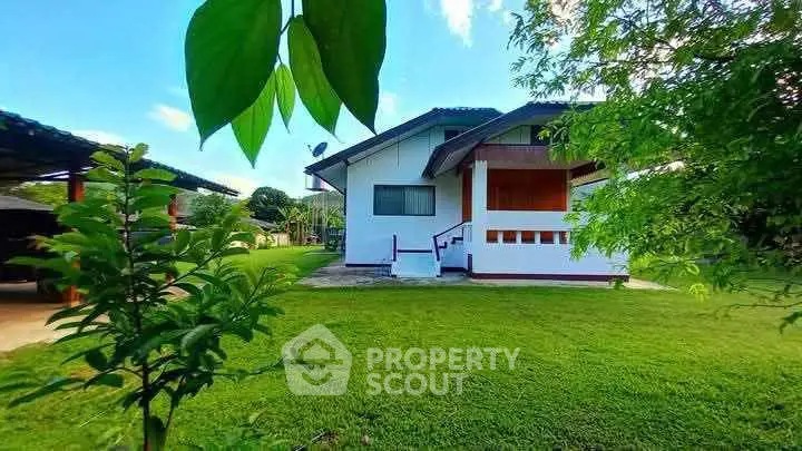 Charming single-story house with lush green lawn and modern design.