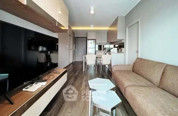 Modern living room with sleek furniture and open kitchen layout